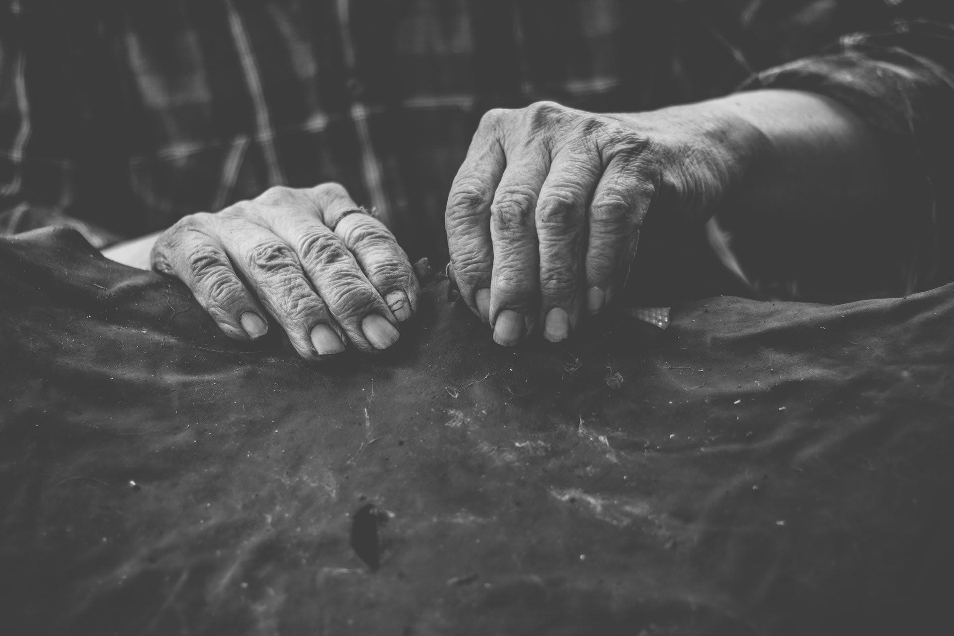 Black and white photo of an old persons hands.
