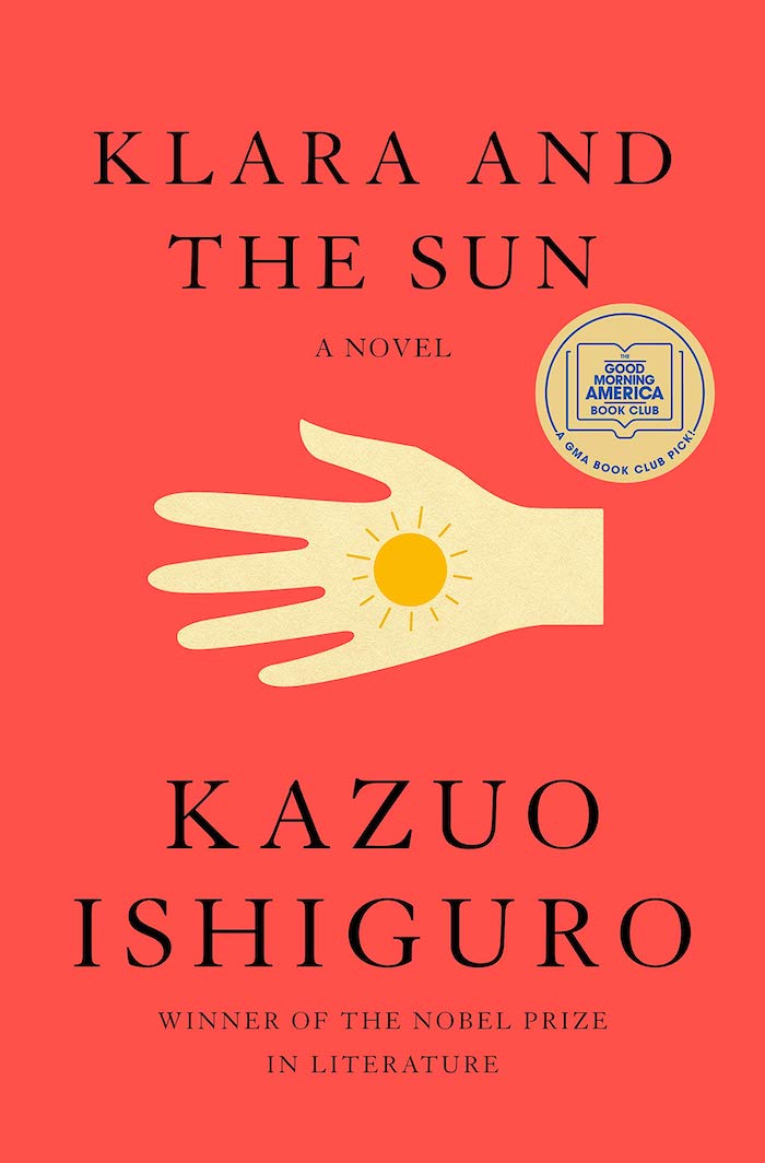 The book cover is bright salmon color. There is a drawing of a hand which has the figure of the sun on its palm.